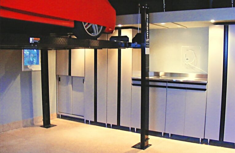 2 car garage willowdale showcase - 4 post hydraulic car lift, garage cabinets, polyaspartic garage flooring, overhead platform storage, tire storage, satinless steel work station, flatscreen tv fixture