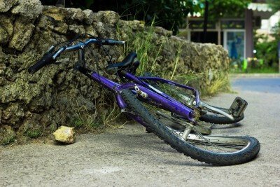bicycle damaged by car in driveway - lack of garage storage system