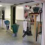 1 car garage markham slatwall organization system cabinets recycle green bin storage polyaspartic coated stair floors punched aluminum wainscoting