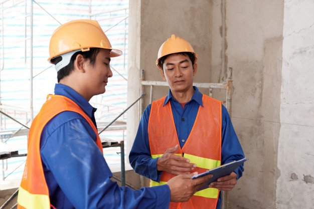 contractors insulating a garage