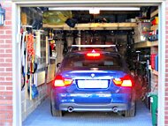 1 car garage parks bmw plus 7 high end bicycles, portable workshop and all tools