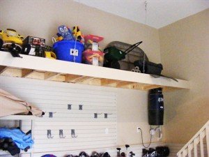 garage-storage-custom-overhead-platform-toy-storage-slatwall-camlock-hooks-bicycle-helmets-golf-clubs-stairs-bannister-central-vacuum-garden-tools