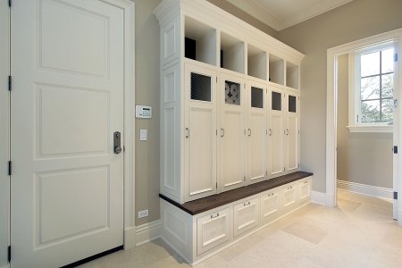 mudroom in new construction garage with lockers