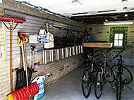 nuvo garage 1 car garage high park toronto renovation interior design slatwall bike rack overhead platform garden tools sports recycling left view after