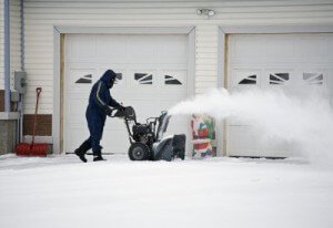 seasonal garage storage changeover - shovel, snowblower, decorations - winter